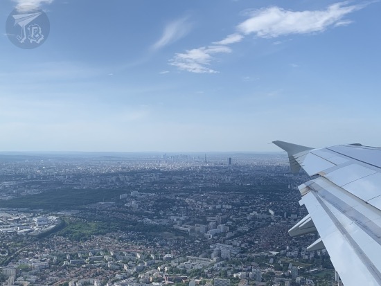 A view of Paris from the plane, also showing the wing